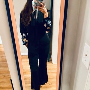 Black jumpsuit with floral embroidery
